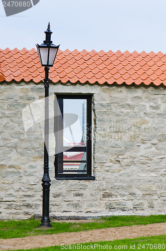 Image of Window aperture in a wall from calcareous stones, a close up