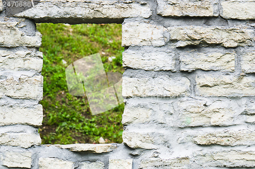 Image of Window aperture in a wall from calcareous stones, a close up