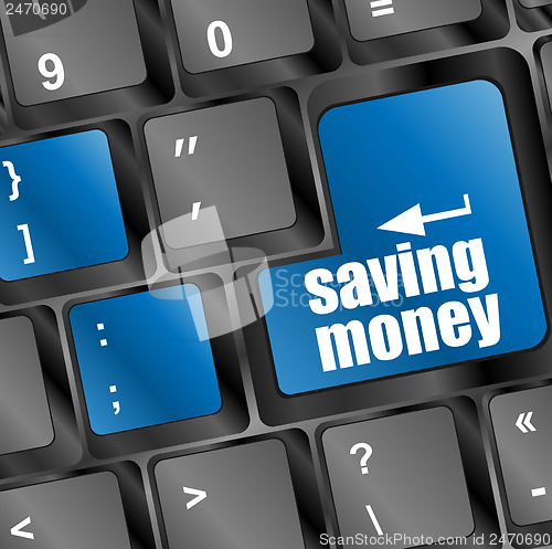 Image of save money for investment concept with a blue button on computer keyboard