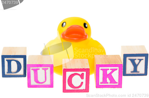 Image of Baby blocks spelling ducky with a rubber duck