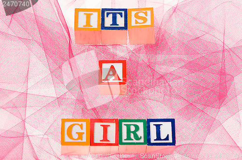 Image of Letter blocks spelling 'its a girl'