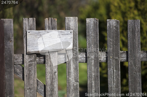 Image of Wooden fence with empty sign board