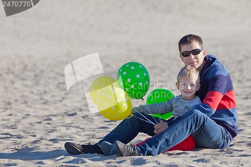 Image of family with balloons