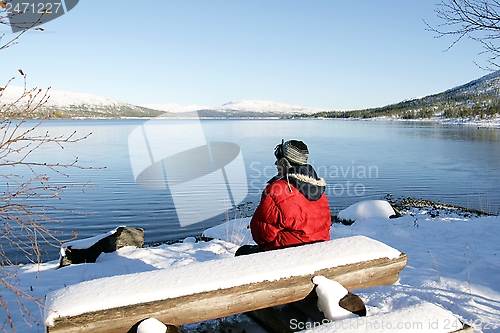 Image of Man by a lake