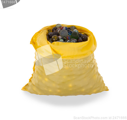 Image of Assorted black glass marbles arranged in a yellow pouch