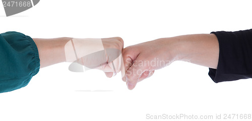 Image of Close up of two women shaking hands