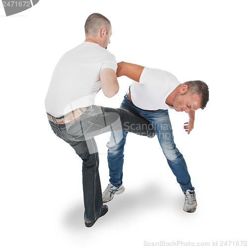 Image of Man defending an attack from another man, selfdefense