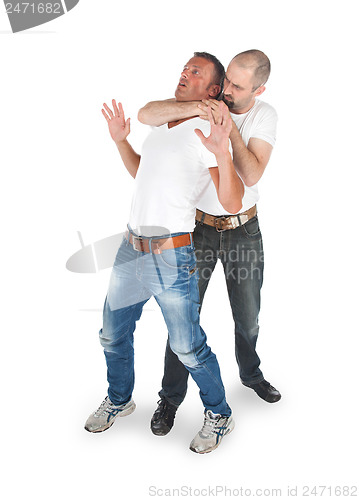 Image of Man attacking from another man