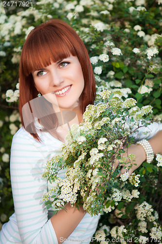 Image of Attractive red-haired woman