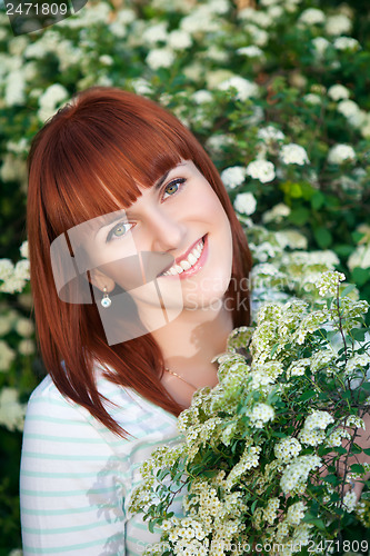 Image of Red-haired smiling woman
