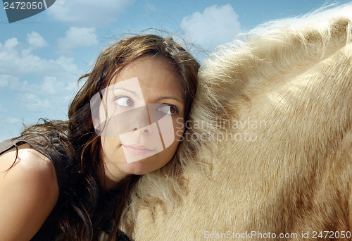 Image of Close-up portrait of the woman on a horse back