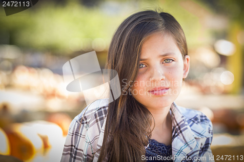 Image of Preteen Girl Portrait at the Pumpkin Patch