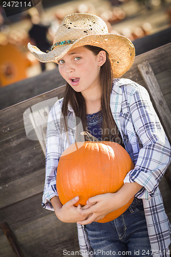 Image of Preteen Girl Portrait at the Pumpkin Patch