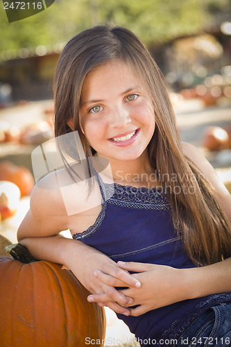 Image of Preteen Girl Portrait at the Pumpkin Patch