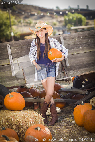 Image of Preteen Girl Portrait at the Pumpkin Patch