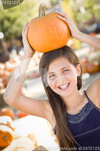 Image of Preteen Girl Portrait at the Pumpkin Patch