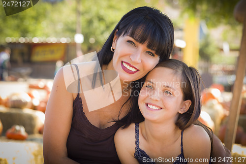 Image of Attractive Mother and Daughter Portrait at the Pumpkin Patch
