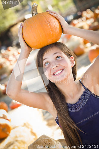 Image of Preteen Girl Portrait at the Pumpkin Patch