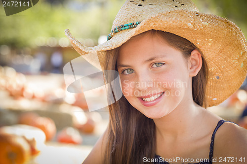 Image of Preteen Girl Portrait Wearing Cowboy Hat at Pumpkin Patch