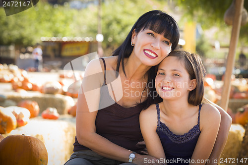 Image of Attractive Mother and Daughter Portrait at the Pumpkin Patch
