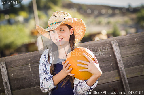 Image of Preteen Girl Portrait at the Pumpkin Patch