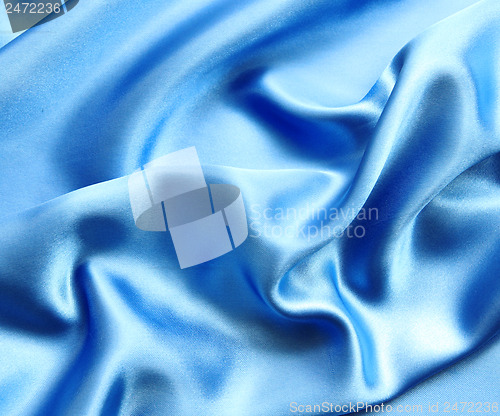 Image of Smooth elegant blue silk as background 