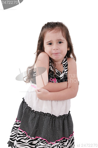 Image of angry little girl in dress with arms crossed on white background