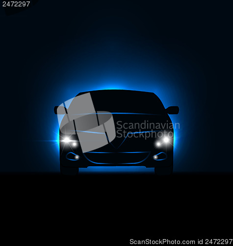 Image of Silhouette of car with headlights in darkness 