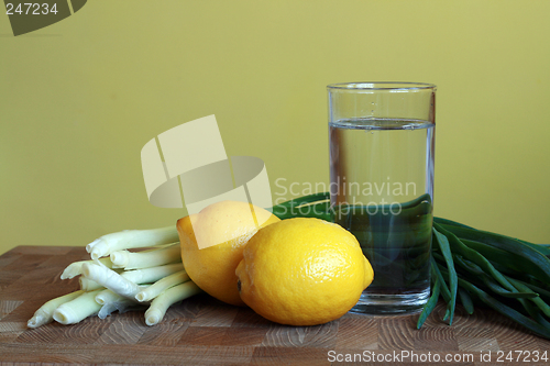 Image of Lemons, onion and glass of water