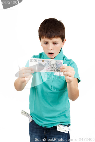 Image of amazed boy looks at the bill