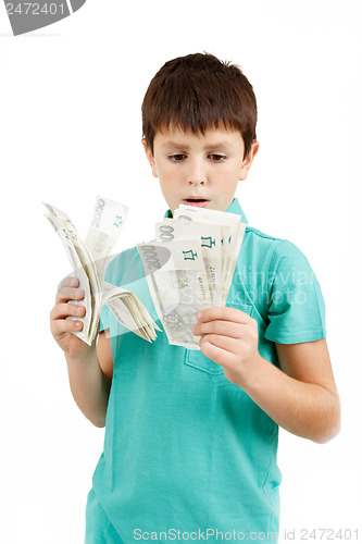 Image of boy holding czech crown banknotes