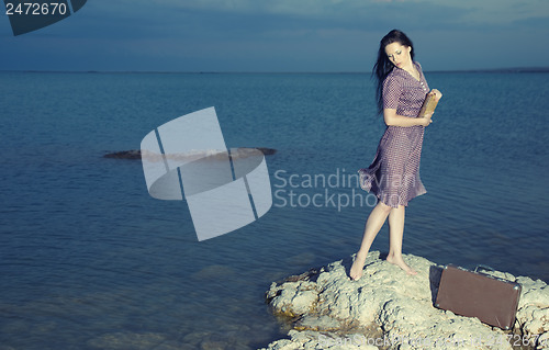 Image of Female reader at the sea