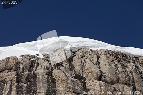 Image of Snow cornice and blue sky