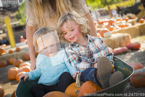 Image of Young Family Enjoys a Day at the Pumpkin Patch