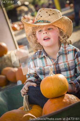 Image of Little Boy in Cowboy Hat at Pumpkin Patch