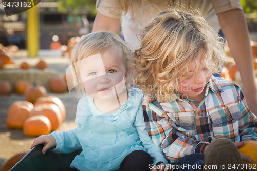 Image of Young Family Enjoys a Day at the Pumpkin Patch