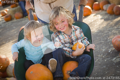 Image of Young Family Enjoys a Day at the Pumpkin Patch