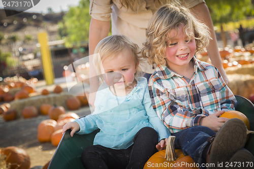 Image of Young Family Enjoys a Day at the Pumpkin Patch