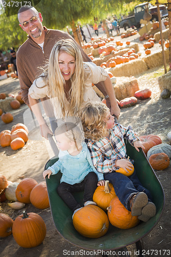 Image of Young Family Enjoys a Day at the Pumpkin Patch