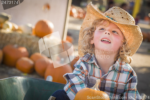 Image of Little Boy in Cowboy Hat at Pumpkin Patch