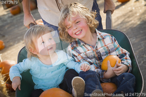 Image of Young Family Enjoys a Day at the Pumpkin Patch