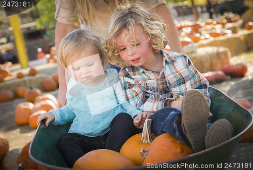 Image of Young Family Enjoys a Day at the Pumpkin Patch