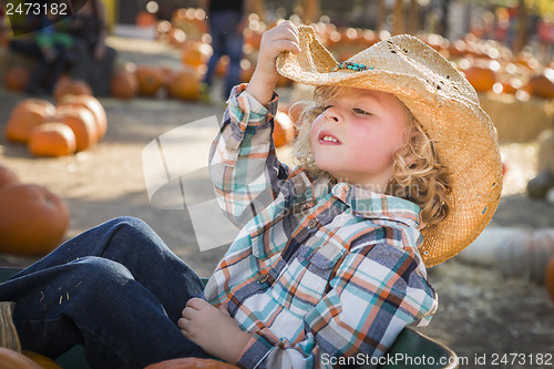 Image of Little Boy in Cowboy Hat at Pumpkin Patch