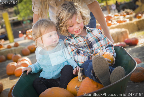 Image of Young Family Enjoys a Day at the Pumpkin Patch