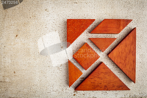Image of wooden tangram puzzle