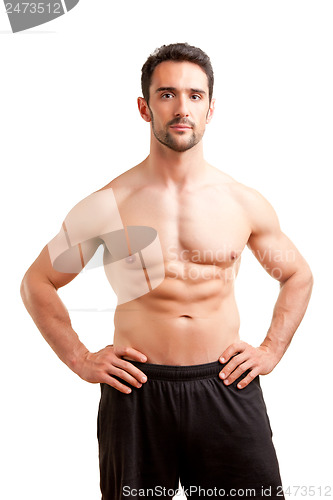 Image of Fit Man Standing With Arms At His Waist