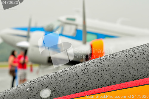 Image of abstract view of airshow during a rain storm