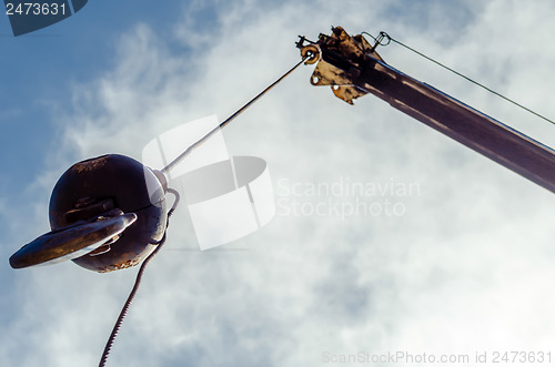 Image of Crane hook on a blue sky