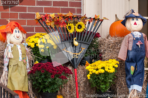 Image of harvest decorations next to a brick building