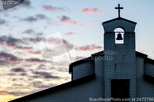 Image of Classic church silhouette on tropical sunset
